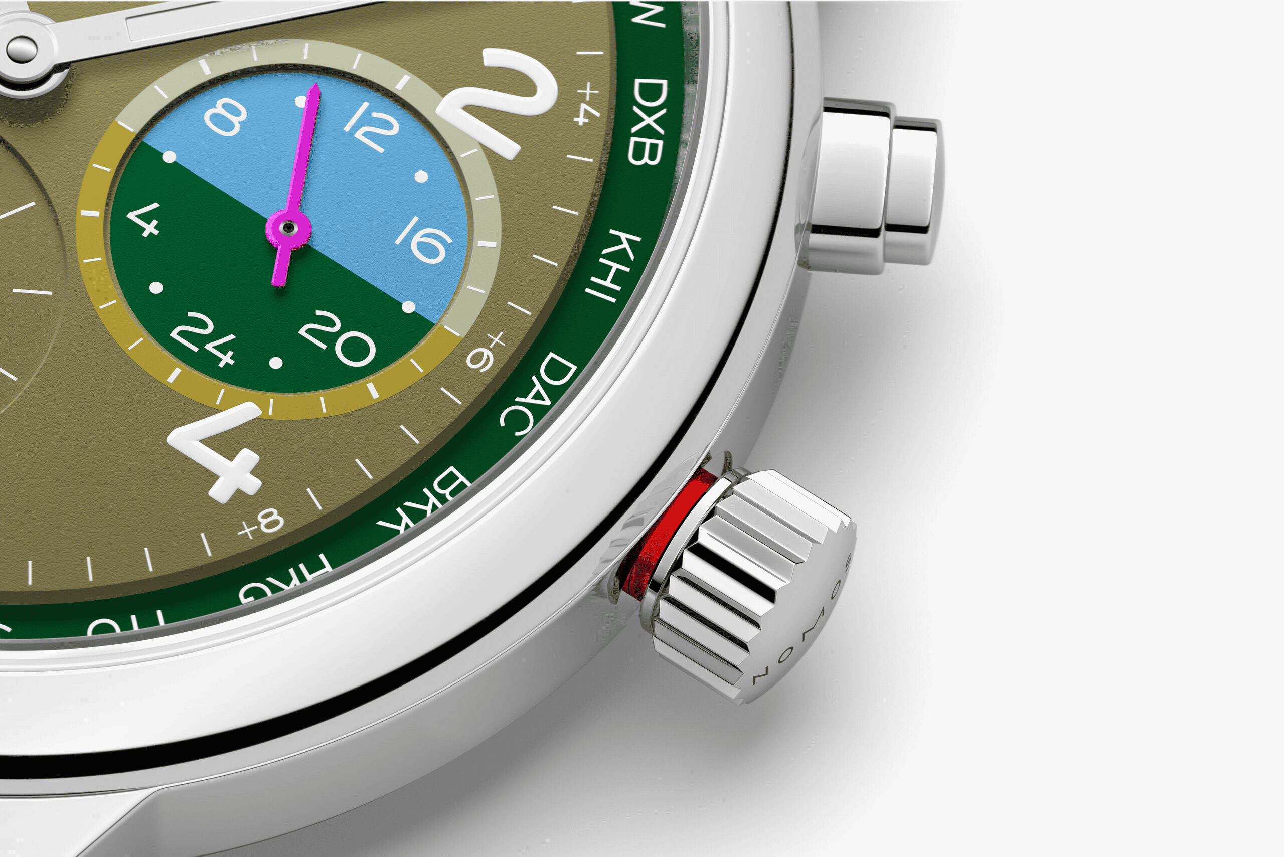クラブ・スポーツ ネオマティック ワールドタイマー ジャングル　NM790.S6NOMOS GLASHÜTTE この腕時計の鮮やかな緑は、鬱蒼とした熱帯雨林を思わせます。熱帯地域の大きな葉っぱの豊かなディープグリーン、下生えのオリーブグリーン、新芽の淡い緑の全てがあり、オーキッドピンクとウォーターブルーの細部は、ダイアルにコントラストをもたらしています。自動巻きキャリバーを搭載するこのワールドタイム機能付き腕時計においては、スポーティーさと機能性が均衡しており、一目で24のタイムゾーンを見ることができ、セカンドタイムゾーンの24時間表示も備わっています。ジャングルは175本限定であり、世界との特別な自分だけの繋がりをもたらします。